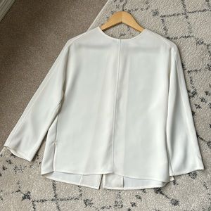 VINCE Elegant split back blouse.
